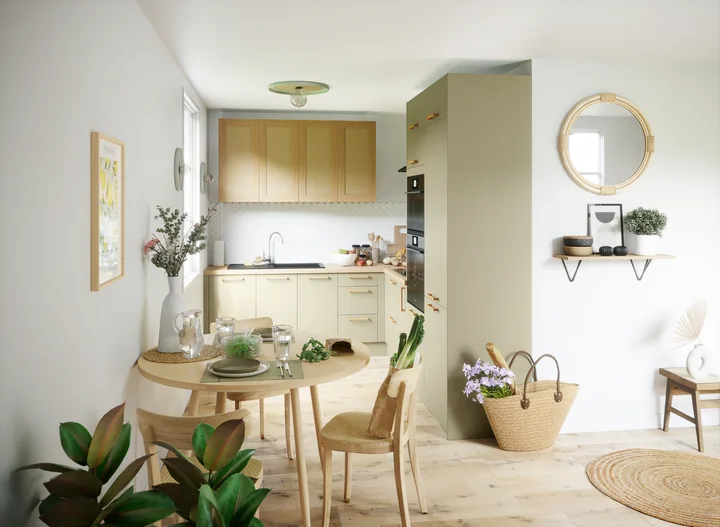 Cuisine Brise aux tons doux, bois clair et coin repas rond
